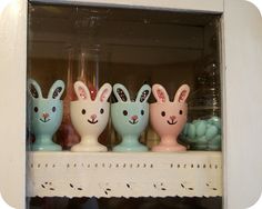 some bunny ears are painted on the side of a shelf