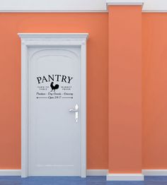 an open door with the words pantry on it in front of a wall painted orange and white