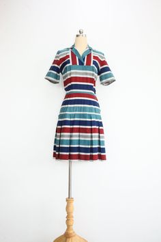 1960s Vintage Cotton Mini Shift Collared Dress with Pleated Skirt M e s u r e m e n t s;    Bust * 43cm / 17"  Waist * 33cm / 13"  Hips *  45cm / 18"   Length * 81cm / 32" Sleeve * 9cm / 3.5" Shoulders * 38cm / 15"  F e a t u r e s; ⁍ medium weight cotton 100% with woven stripe pattern ⁍ fly zipped side closure   ⁍ unlined S p e c i f i c s; label/tag - n/a approx. fit - XS condition - excellent vintage condition flaws found - none  *Measurements are taken along one side of garment lying flat ; Bust = from underarm seam to seam, Sleeve = from underarm seam to end, Waist = narrowest part of skirt from seam to seam, Hips = widest part of skirt from seam to seam, Length = from shoulder hem next to collar to bottom hem, Shoulders = straight line from one shoulder seam to the other ** The best Mod Shift Dress, Twiggy Dress, Scooter Dress, Vintage 60s Dress, Vintage Dress 60s, Striped Dress Summer, Mod Dress, Mini Shift Dress, 1960s Vintage