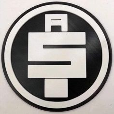 a black and white circular sign with the letter f in it's center circle