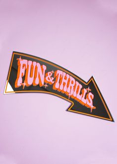 a sticker that says fun and thrills on the side of a pink wall