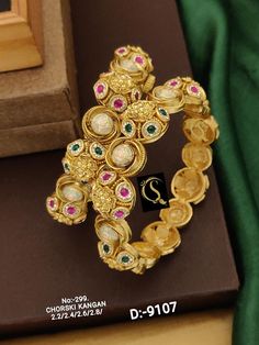 Description :- Bangles Gold Plated Fully Openable Kada Kangan Bangles | Gold Kada Bangles | Gold Patla | Wedding Indian Temple Jewlery | punjabi jewelry Gift yourself a royal look with this perfectly crafted necklace set from Manalisstudio. Crafted with high quality stones and pearls, it is impressive in design. The green enamel artwork adds perfect texture to the design. Perfect for weddings and festivities, this antique Chuda set should be put on with your favorite sari or lehenga. 100% Satisf Temple Jewelry Bangle With Stone Work For Reception, Festive Bangle With Intricate Design For Reception, Traditional Heavy Bangle For Reception, Reception Kundan Bangle With Meenakari, Kundan Meenakari Bangle For Reception, Temple Jewelry Style Tilla Bangle For Reception, Meenakari Kundan Bangle For Reception, Traditional Stone Work Bangle For Reception, Reception Meenakari Kundan Bangle