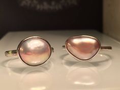 "Modern Pearl Ring. Unique Pearl Ring. Blush Pearl Ring. Solitare Pearl Ring. Trillion Pearl Ring. Pink Pearl Ring. Modern Pearl Ring. Beautifully Handcrafted upcycled bezel set Natural Cultured Pearl set on a lightly hammered solid sterling silver band.. This unique yet very versatile ring is a size 9 1/2 but is available in any size with a very similar Pearl and is sure to be your go to accessory and is perfect for wearing on any finger. . ❤️❤️Give the thoughtful gift of handcrafted. ❤️❤️ Grea Pink Teardrop Fine Jewelry Ring, Pink Stackable Open Ring Jewelry, Pink Oval Stackable Jewelry, Pink Stackable Open Ring, Pink Pearl Ring For Wedding, Adjustable Pink Ring Fine Jewelry, Adjustable Pink Fine Jewelry Rings, Pink Moonstone Sterling Silver Ring For Anniversary, Pink Teardrop Anniversary Ring