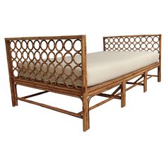 a wooden bed frame with a white mattress on it's back end and side rails