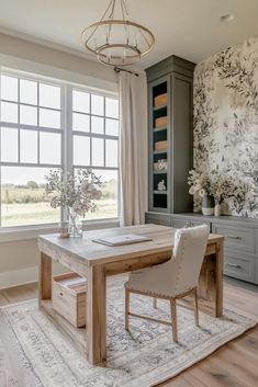 a dining room with a table and chairs in front of a large window that has flowers on it