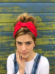 Fabric turban head band in a high quality plain red, based on the 1940s land girl style and 1950s Rockabilly fashions. A real statement piece with a standard 1 inch width inner hair band attached within the lining to provide an easy to wear design. Our range of turban bands are the perfect easy to wear accessory and are worn exactly as an Alice band finishing behind the ears. (These bands do not go all the way around the back of the head, so are perfect for all hair styles.) This unique creation Trendy Festival Headscarf In Headband Shape, Festival Headwrap Headband, Trendy Summer Turban Styled As Headband, Adjustable Red Bandana Headband, Casual Adjustable Red Headscarf, Red Bohemian Headband Headscarf, Red Bohemian Headscarf Headband, Trendy Turban With Matching Headband, Red Festival Headwrap