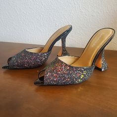 Lemonade Glitter Slip On Heeled Mules Size 7 Purchased On Dolls Kill. These Shoes Are So Awesome, But Unfortunately They Were A Little Two Small For Me. Never Worn, Just Tried On! They Are Completely Covered In Glitter And Appear Almost Like A Light Black And Has Holographic Glitter So They Sparkle All Different Colors! Size 7 *Please Reference Pictures For Measurements 9 Inches Long 3 Inches Wide At The Ball Of The Foot Comes From A Smoke-Free, Pet Friendly Home! Glitter Open Heel Synthetic Heels, Glitter Accents Open Toe Heels For Night Out, Glitter Accented Open Toe Heels For Night Out, Open Toe Heels With Glitter Accents For Night Out, Spring Evening Heels With Shimmer, Spring Evening Shimmer Heels, Fitted Open Toe Glitter Heels, Sparkling Synthetic Heels For Evening, Spring Glitter Heels In Synthetic Material