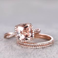 two wedding rings with an morganite and diamond band