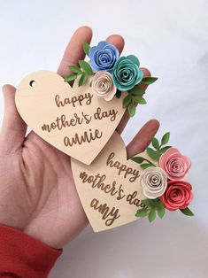 two handmade paper hearts with flowers on them that say happy mother's day