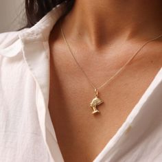 14K Gold Nefertiti Necklace, Egyptian Necklace, African Necklace For Women D E T A I L S * Gold KT: 14K Gold * Gold Color: Yellow Gold * Pendant Dimensions:  Pendant Height : 18 mm ,Width : 15 mm ,Weight : 1.4 gr S H I P P I N G & R E T U R N S * Ready to Ship in 1-2 Business Days * FREE shipping on all U.S. orders  * Packed in labeled gift box C O N T A C T Contact us with any inquiries by Etsy convo! S H O P Check out my shop https://www.etsy.com/shop/DesignGoldJewelry Go Directly to My Sectio Gold Ankh Necklace For Gift, Yellow Gold Ankh Necklace, Egyptian Style Necklace, Africa Necklace Gold, Nefertiti Necklace, Nefertiti Pendant, Egyptian Necklace, Necklace African, African Necklace