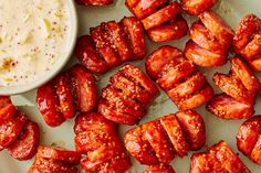 Hasselback Sausage Bites are a fun appetizer for your next gathering, sports-related or otherwise. Get more crispy, snappy bites of sausage with these sliced-up links. Cocktail Sausage Recipes Appetizers, Smoked Sausage Finger Food, Conecuh Sausage Recipes Appetizers, Conecuh Sausage Recipes, Kilted Sausage Bites, Southern Appetizers, Breakfast Party Foods, Sausage Bake