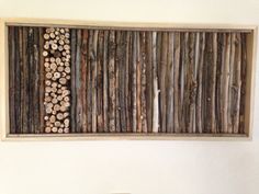 a wall hanging made out of wood logs