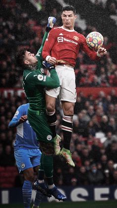 two soccer players jump to head the ball