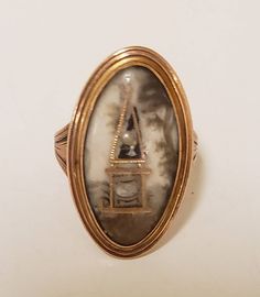 This is a Beautiful Sepia Urn Mourning Ring. It is from the Georgian era. I have included the engraving on the back. It is in wonderful condition. Tests as 18k Gold. This is a very rare and special piece in wonderful condition. Currently a size 6.5 but easily sizable by any local jeweler. A piece of history that will always be remembered. All questions welcome. Thank you kindly. Luxury Antique Engraved Ceremonial Ring, Victorian Ceremonial Signet Ring With Intaglio, Victorian 14k Gold Intaglio Engraved Ring, Edwardian Navette Ring, Vintage Eternity Band, Victorian Engraved Gold Brooches, Baguette Diamond Band, Ring Engraving, Yellow Gold Solitaire Ring