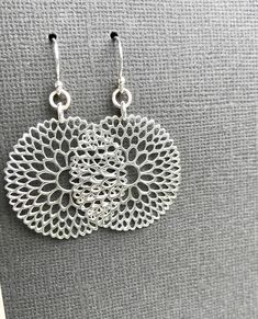 Mandala Earrings Beautifully detailed geometric earrings in bright sterling silver. Intricate mandala design evokes an end-of-summer dahlia in all its glory. Lightweight, bright and lovely! NEW: now available on sterling silver stud/post earring backs. Mandala is 30mm diameter, about 1-1/4 inch Beautifully finished on both sides Ball-end ear hooks Earring length overall is 2 inches All earring components solid sterling silver Earrings come with silicone backs to keep them securely in place. Matc Silver Filigree Dangle Flower Earrings, Hypoallergenic Sterling Silver Chandelier Drop Earrings, Hypoallergenic Teardrop Flower Earrings In Sterling Silver, Hypoallergenic Sterling Silver Teardrop Flower Earrings, Nickel-free Sterling Silver Teardrop Flower Earrings, Bohemian Silver Flower Shaped Earrings, Bohemian Silver Flower-shaped Earrings, Silver Bohemian Flower-shaped Earrings, Modern Sterling Silver Chandelier Earrings As Gift