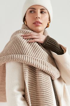 Make your style A LOT cozier with our extra-long Bronx Scarf. Bronx is both knit from ultra-soft French Merino Wool mix to warm your soul and fashioned extra long to make a statement. Wrap this Merino wool scarf around and around for volume, or wear her draped over your shoulders to lend your look texture and drama. This soft wool scarf also doubles perfectly as an airplane blanket.[SPLIT] Julia, in light beige, is 5'10" (178 cm) tall, wearing size XS. Natalee, in medium grey, is 5'10" (178 cm) Knit Winter Scarves, Cold Weather Knit Scarves, Warm Wool Scarves For Cold Weather, Knitted Wool Scarves For Fall, Fall Knit Scarf For Cold Weather, Warm Knit Scarves For Fall, Knit Scarf For Fall Cold Weather, Knit Scarves For Fall Cold Weather, Knit Scarf For Cold Weather And Fall