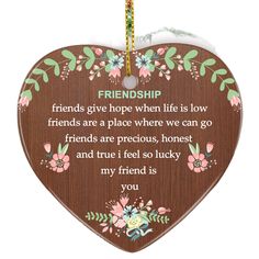 a wooden heart shaped ornament with the words, friends give hope when life is low