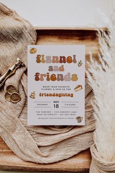 a card that says flame and friends on it next to a pair of gold scissors