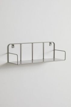 Display your trinkets with the timeless touch of this floating wall shelf. Crafted from steel, this essential features curving edges for a soft touch with a rectangular shelf at the base. Features Essential wall shelf Crafted from tubular steel with curving edges Versatile - use it in your living space to display your collection of trinkets or in your kitchen to store your spices Wall mount capable Content + Care Mounts to wall - hardware included 100% Steel Wipe clean Imported Size Dimensions: Stainless Shelves, Metal Wall Shelf, Chrome Shelves, Chrome Shelves In Bathroom, Chrome Wall Shelf, Contemporary Metal Wall Shelf, Chrome Bathroom Shelves, Chrome Metal Shelf, Acrylic Wall Shelf