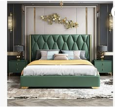 a bedroom with a green headboard and gold accents