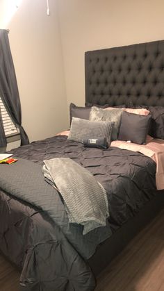 the bed is made up and ready for someone to use it in their home or office