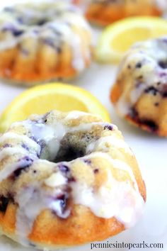 lemon blueberry donuts with icing on a plate