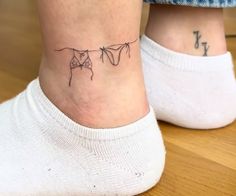 two people with tattoos on their legs and one has a bow tie tattoo on the ankle