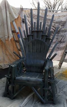 an iron throne sitting on top of a tarp