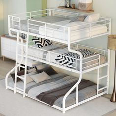 a white bunk bed sitting on top of a wooden floor