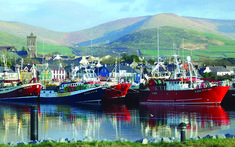 there are many boats that are docked in the water at this town's marina