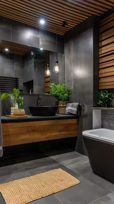 a bathroom with a large tub, sink and wooden paneled wall in the background