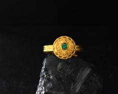 Gold and emerald, what a better combo to highlight the ancient Greek techniques used in the making of this ring. A lovely 22 Karat solitaire ring featuring a 0.12ct emerald stone. The diameter of the disc is 13mm. One of a kind, made especially for you! Handmade in our traditional Greek workshop in the historical center of Athens, with attention to detail and passion for craftsmanship. If you have any questions, please contact us! We will gladly assist you! Other options: ● https://www.etsy.com/ Ancient Yellow Gold Jewelry For Ceremonial Occasions, Ancient Style Yellow Gold Jewelry For Ceremonial Occasions, Ancient Style Yellow Gold Ceremonial Jewelry, Gold Emerald Ring With Intricate Heirloom Design, Gold Emerald Heirloom Ring With Intricate Design, Ceremonial Yellow Gold Emerald Heirloom Ring, Ceremonial Heirloom Yellow Gold Emerald Ring, Ancient Ceremonial Hallmarked Jewelry, Ancient Ceremonial Jewelry