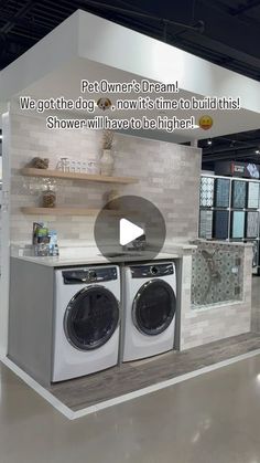 a showroom with two washers and a dryer