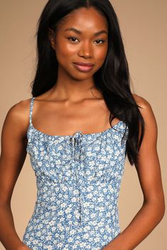 Everyone knows a little day dress can be a true wardrobe hero, and the Lulus Daisy Days Blue Floral Empire Waist A-Line Mini Dress is here to save the day! Lightweight woven fabric, decorated with a simple floral motif, shapes this flirty little dress. A tying drawstring neckline creates a keyhole detail as it tops the gathered bodice atop the empire waist. Adjustable spaghetti straps, a back zipper, and a sweet A-line skirt finish the look. Fit: This garment fits true to size. Length: Mid-thigh Blue Sundress With Tie Straps For Spring, Blue Maxi Dress With Tie Straps For Garden Party, Blue Ditsy Floral Mini Dress For Spring, Blue Maxi Dress With Ditsy Floral Print For Summer, Blue Mini Dress With Ditsy Floral Print For Spring, Blue Midi Dress With Ditsy Floral Print For Summer, Blue Tie Straps Dress For Garden Party, Blue Garden Party Dress With Tie Straps, Blue Dress With Tie Straps For Garden Party