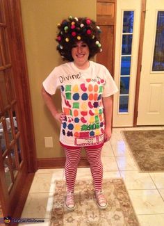 a woman wearing a t - shirt with an afro on her head and striped tights