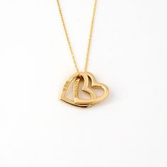 1- P R O D U C T ∙  D E S C R I P T I O N Made with meticulous craftsmanship, this delicate Engraved Two Heart Necklace in 14K Solid Gold is the epitome of timeless elegance. Perfect as a girlfriend gift, this dainty interlocking heart name necklace is a symbol of enduring love. Our 14k yellow gold necklaces for women are personalized, offering a unique touch to your everyday style. Experience luxury and sentimentality in one exquisite piece. 2- P R O D U C T ∙  D E T A I L S Gold material: 14K Classic Double Heart 14k Gold Necklaces, Classic 14k Gold Double Heart Necklaces, 14k Gold Engraved Double Heart Jewelry, Engraved 14k Gold Double Heart Jewelry, Personalized Double Heart Gold Plated Necklace, Timeless Heart-shaped Necklace For Valentine's Day, Stamped 14k Yellow Gold Double Heart Jewelry, 14k Stamped Yellow Gold Double Heart Jewelry, Yellow Gold Jewelry Stamped 14k With Double Heart