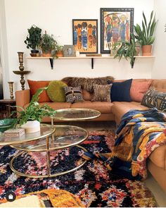 a living room filled with lots of furniture and plants on top of it's shelves