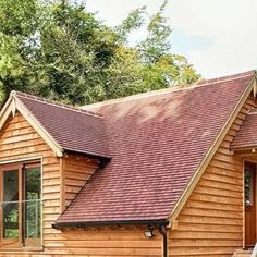 a small wooden house with a red roof