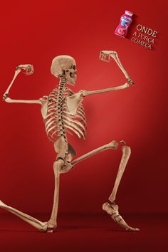 a skeleton is running with its arms and legs in the air