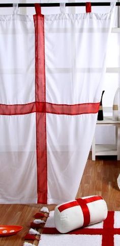 a red and white striped curtain in the corner of a room