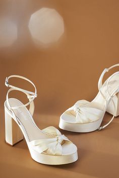 Boasting a twist knot at the toe and a chunky block heel, these shoes instantly take you from formal ceremonies to reception dance floors. Reception Dance, Wedding Platform, White Heels Wedding, Bride Heels, Semi Formal Shoes, Formal Heels, Designer Wedding Shoes, Dance Floors, Wedding Shoes Bride