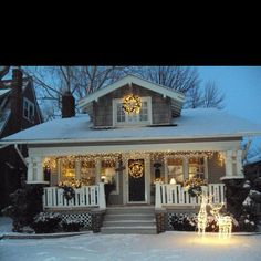 a house with christmas lights on the front porch