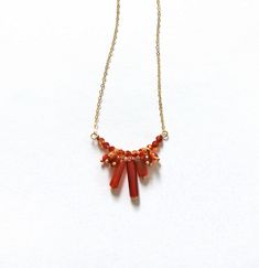 Make way for Autumn! This necklace captures a cluster of carnelian stones in a statement piece. Carnelian, known for its rich orange-red hues, brings a warm, fiery glow to the necklace. Carnelian Necklace, Carnelian Stone, Necklace Shop, Orange Red, Statement Pieces, Jewelry Collection, Orange, Stone, Red