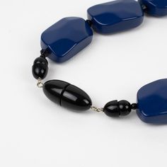 This is part of Chairish’s Costume Jewelry assortment.  Elegant Angela Caputi, made in Italy resin choker necklace.  This necklace features chunky carved pebble beads with a central round domed bead with crystal rhinestones spacers and works on cobalt blue and white contrast. Her matching of colors is always extremely classy, perfect for casual and fancy occasions. As you know, Caputi jewelry is not signed. It is a pre-owned necklace, the plastic tag was removed, but it has the brand's signature Adjustable Elegant Resin Necklace, Cobalt Blue, Cobalt, Crystal Rhinestone, Costume Jewelry, Choker Necklace, Blue And White, Carving, Beads