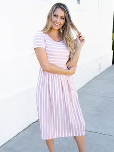 Looking for a dress that's both stylish and comfortable? Look no further than our Striped Midi Dress! With its classic stripes and midi-length, this dress is perfect for any occasion. Whether you're running errands or going out for a night on the town, this dress has got you covered. Pair it with a jean jacket and sneakers for a casual look, or dress it up with some great jewelry and heels for a more formal affair. Size: Small 0-4 Medium 6-8 Large 10-12 XL 12-14 Striped Dresses, Maxi Skirt Dress, Breezy Dress, Striped Midi Dress, Pink Midi Dress, Knee Length Dresses, Pocket Dress, Pink Stripes, Womens Midi Dresses