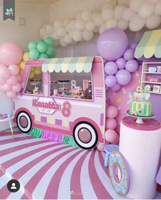 a pink ice cream truck decorated with balloons and streamers for a birthday party or baby shower