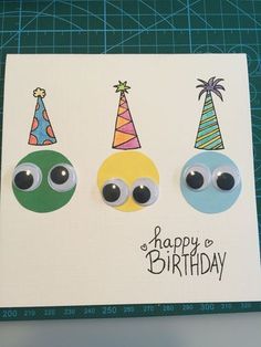 three birthday cards with googly eyes and hats