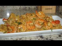 shrimp and rice dish served on a white plate