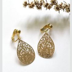 Statement clip on earrings in a gold teardrop shape on our very comfortable clip on findings.  These gold clips will add a sparkle to an outfit.  Perfect for dinner or work or play. All of our filigree earrings are lightweight and are a distinct splash of colour pair of earrings while still being comfortable. My Filigree earrings also make the perfect gift.  And I offer gift wrapping and a card so you can have your gift purchase posted directly to your friend or loved one. THINGS TO KNOW *  3cm Drop Clip-on Earrings For Gift, Gold Pierced Drop Earrings As Gift, Gold Pear-shaped Teardrop Earrings For Gift, Gold Pear-shaped Teardrop Earrings As Gift, Gold Teardrop Pierced Earrings, Gold Teardrop Drop Earrings, Gold Clip-on Drop Jewelry, Hypoallergenic Teardrop Clip-on Earrings As Gift, Pierced Pear-shaped Teardrop Earrings