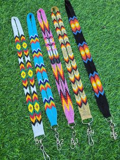 four different colored lanyards on the grass